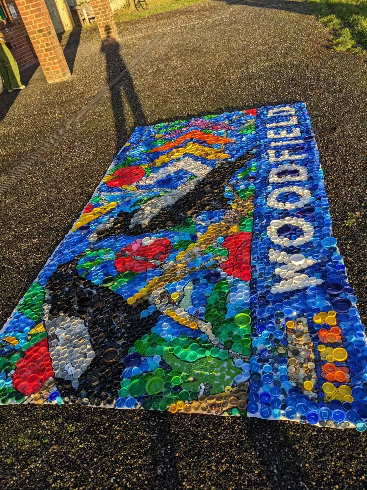 IT'S FINISHED!!
The WOODFIELD sign is finally complete - a stunning collection of lids, buttons and recycled bits and bobs. 
🧡💛💚🩵💜
A huge thank you to everyone involved who came and sewed, collected lids, donated buttons and joined in the fun. 

