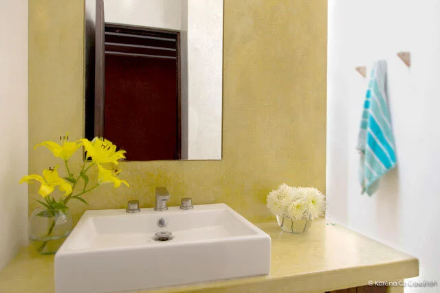 Bathroom is modern and bright.