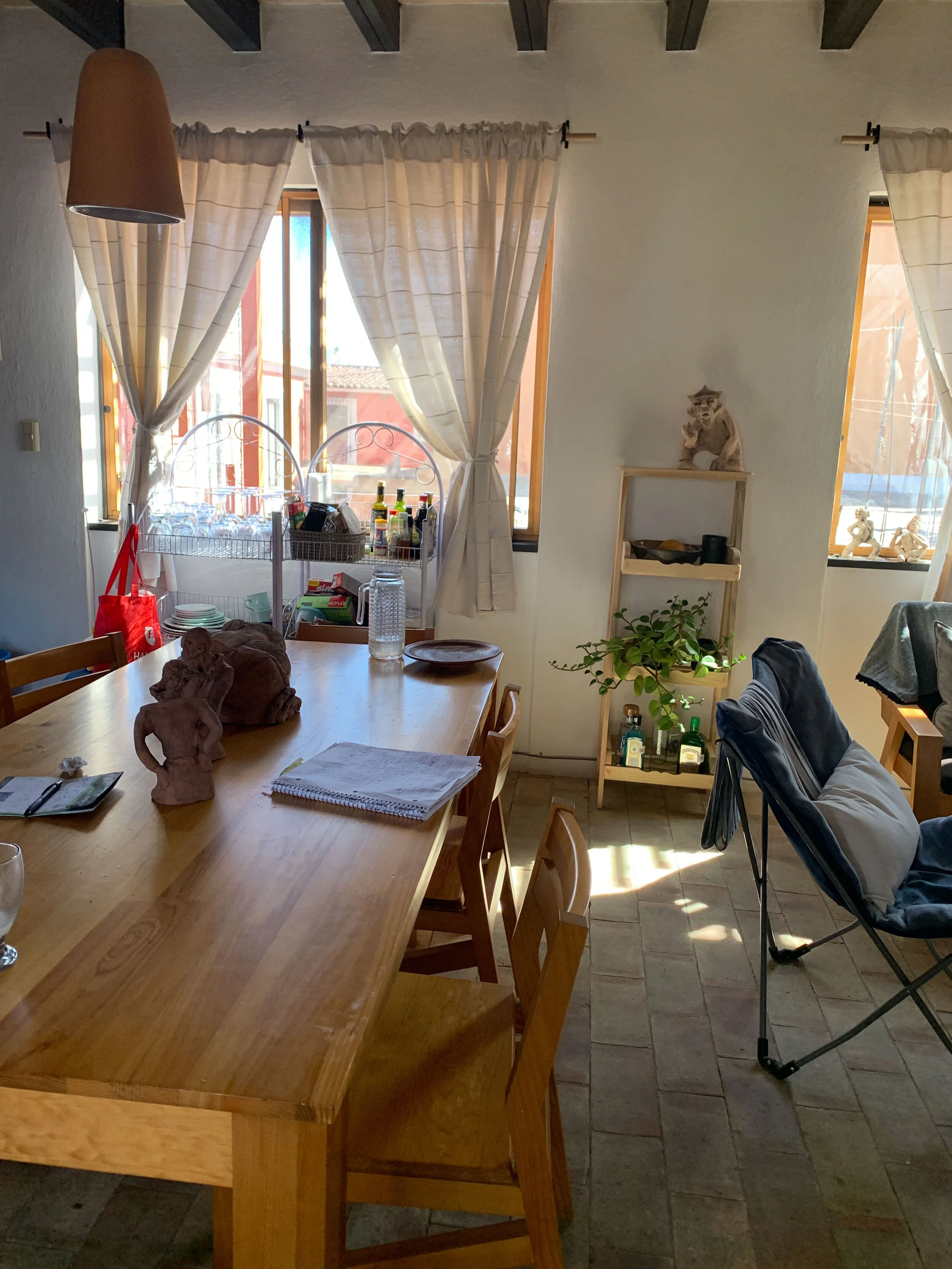 A big dining room table separates the kitchen area from the living room.  Plenty of room for entertaining and an extra work space.