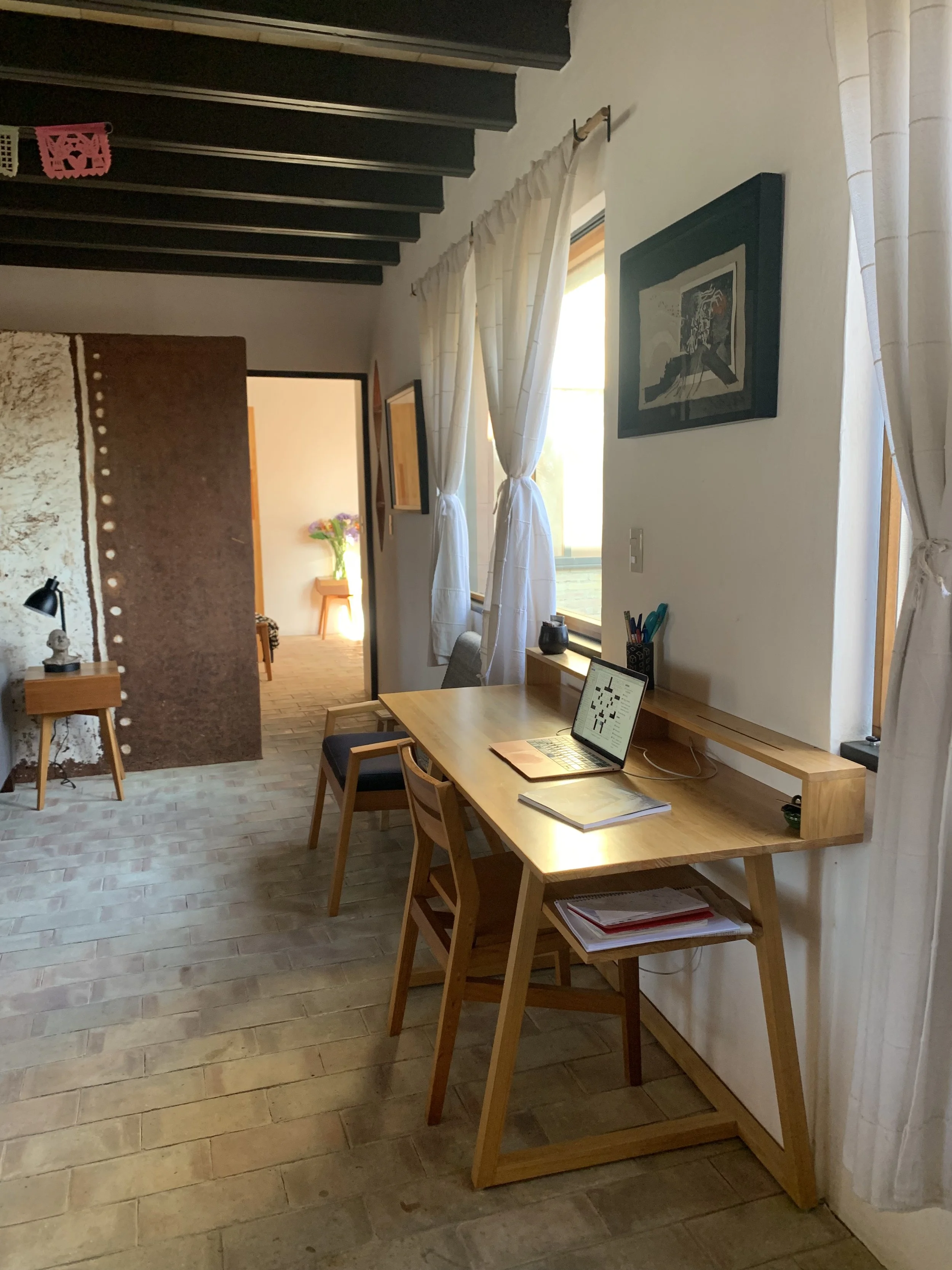 View from the desk through the hallway to the back  bedroom.