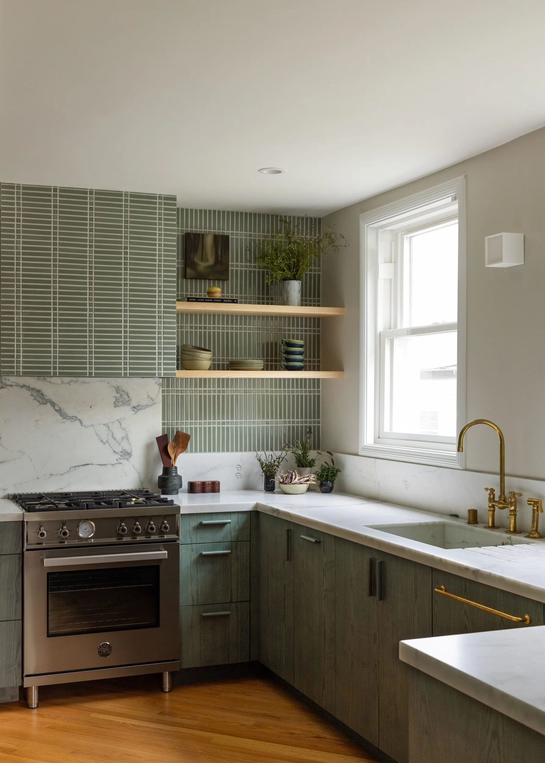 Kitchen with green ash cabinetry, unlacquered brass faucet, handmade green tile and honed marble, 1941 Spanish Revival