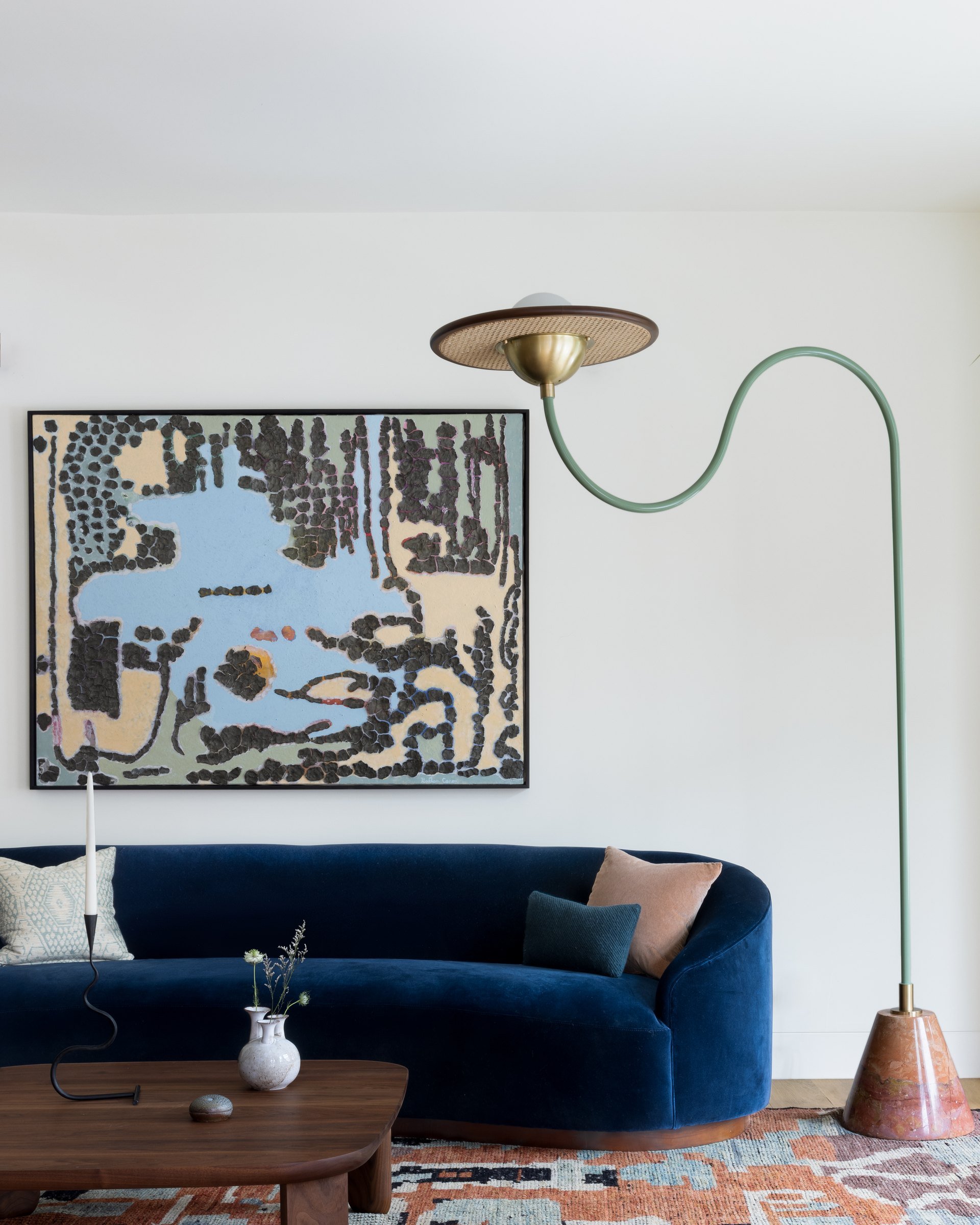 Vintage 1963 Adrian Pearsall sofa in deep blue velvet with a Cassini floor lamp and Gaétan Caron painting in a San Francisco Edwardian parlor