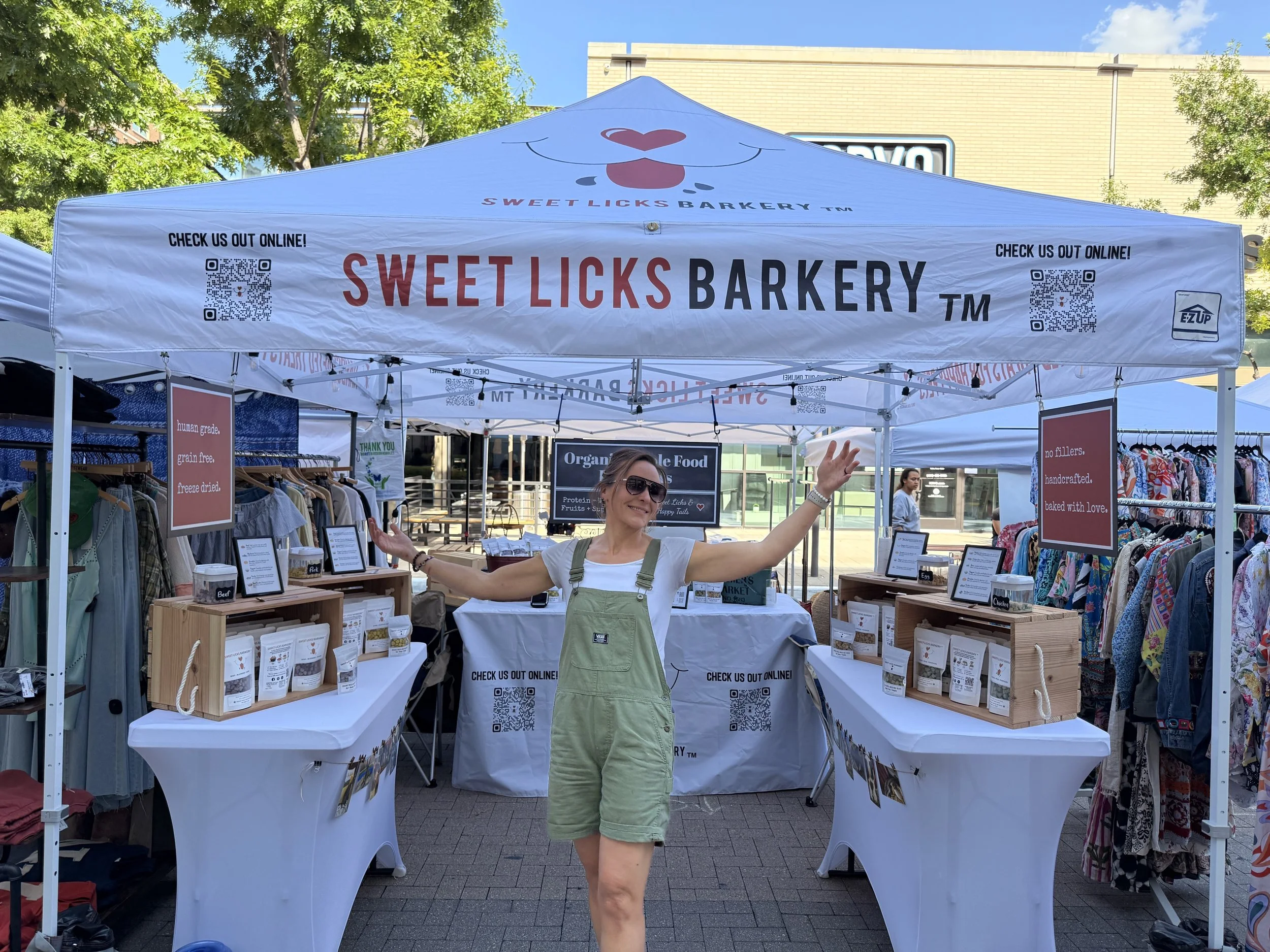 Sweet Licks Barkery booth selling organic dog treats at a local DFW farmers market.
