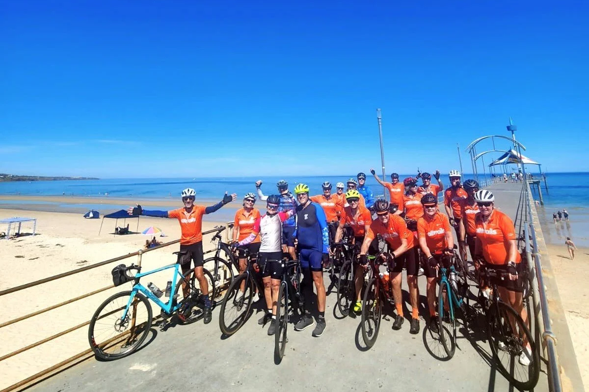 Cycling group having fun at the beach