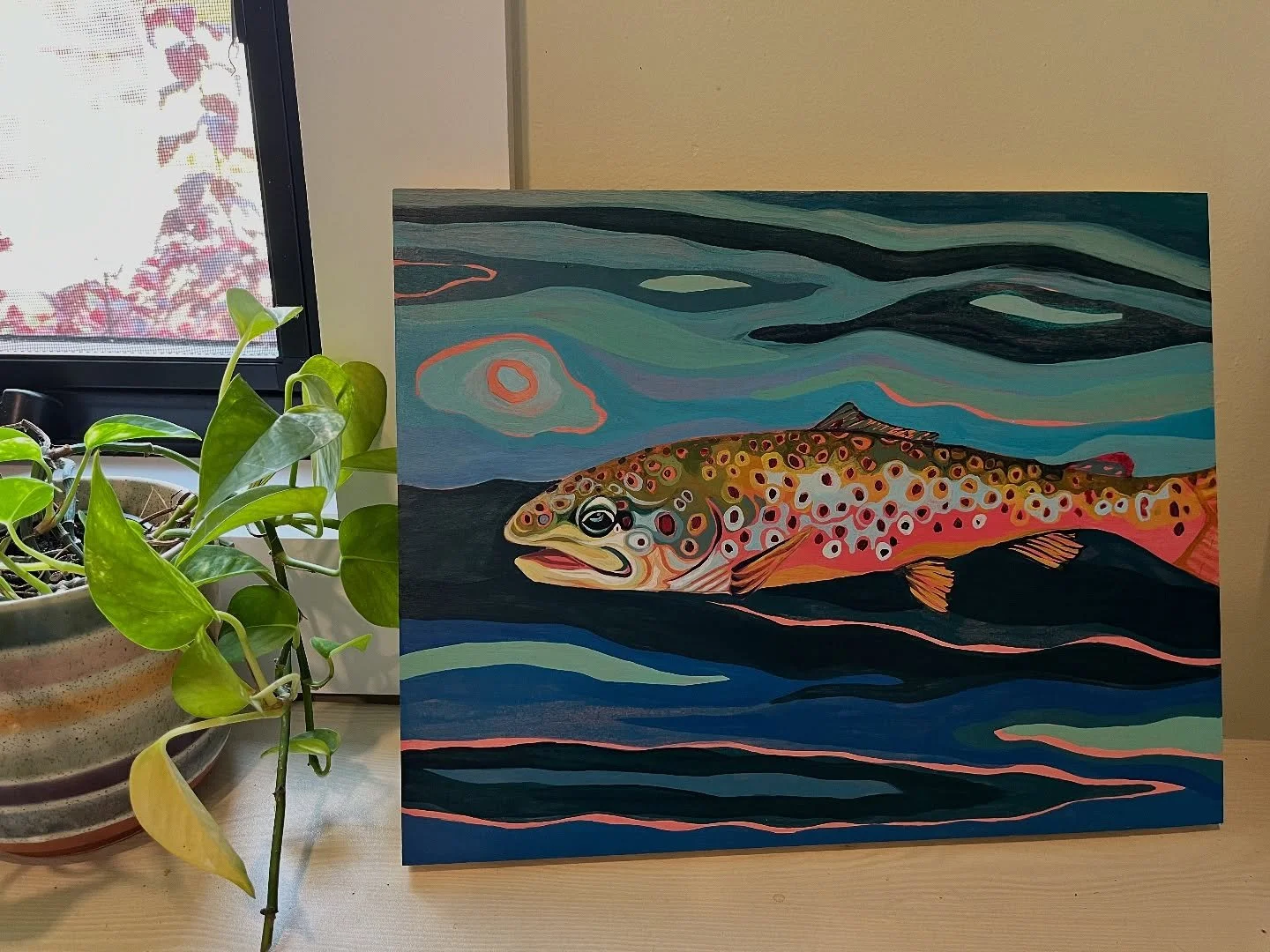 Following the grain of the wood for the background design on this rainbow 🌈. #rainbowtroutpainting #troutpainting #vermontartist #burlingtonartist #acryliconwood #woodgrain