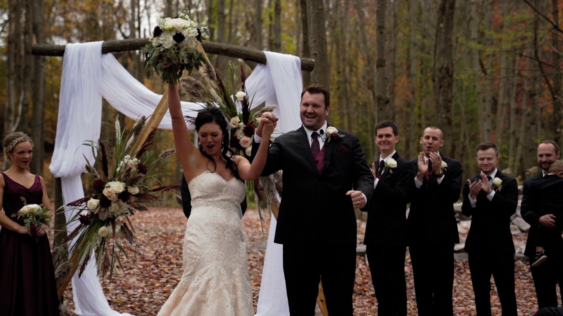 Bride and Groom Exiting their outdoor ceremony at the swan barn door wedding venue