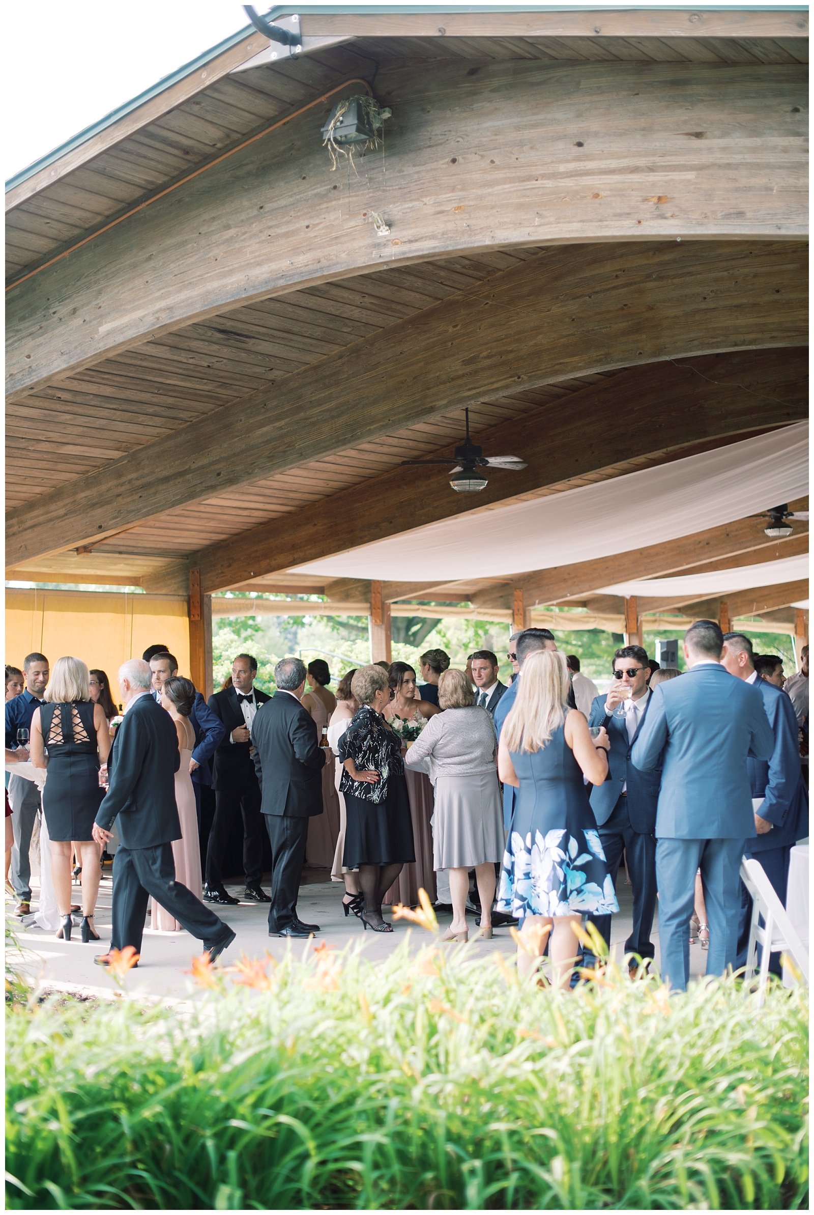 Cocktail hour under a covered Pavillion at Grand Geneva wedding