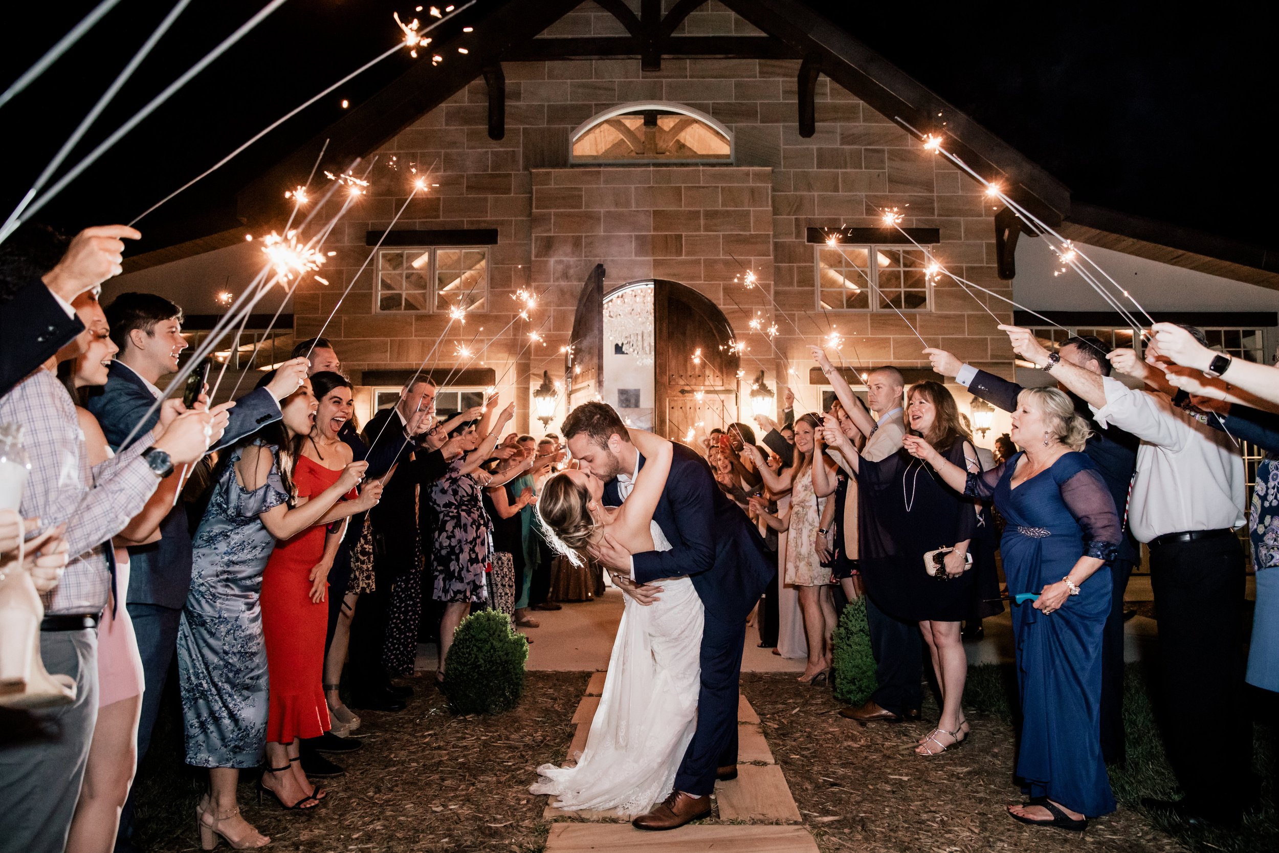 Bride and groom exit The Ridge Wedding Venue with sparklers