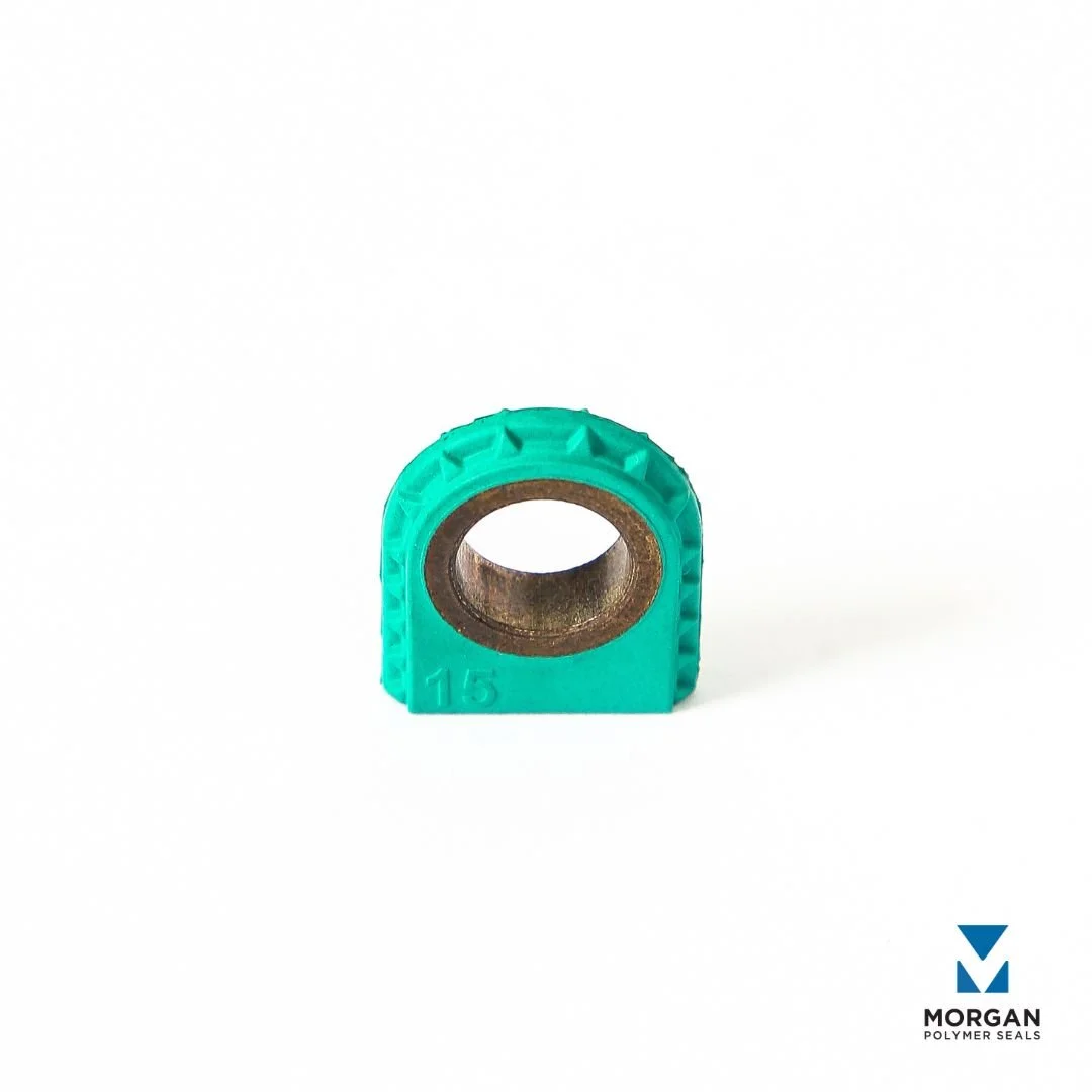 Green FKM overmolded on bronze for intake manifold valve actuator