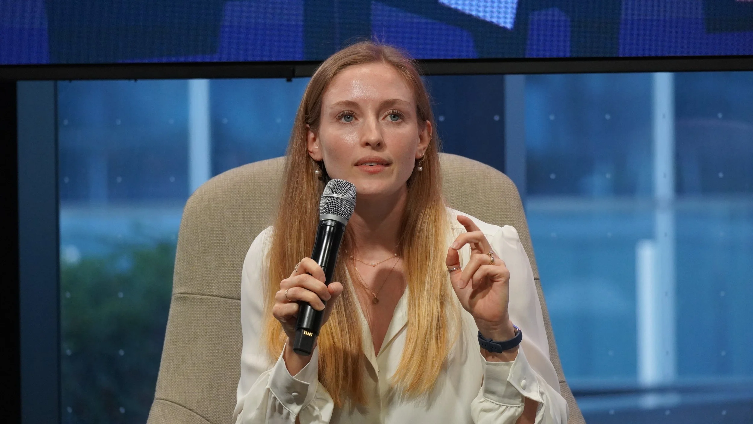 Natural light portrait of a woman speaking at a professional conference in Toronto.