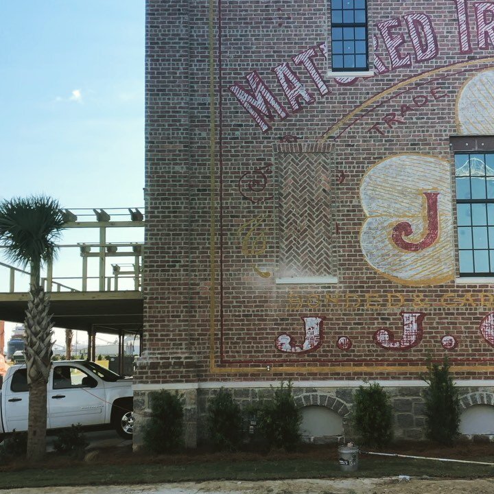 The team recently replicated two vintage whiskey labels on opposite sides of this warehouse along the river in Savannah, Georgia. #ghostsigns #thelossprevention