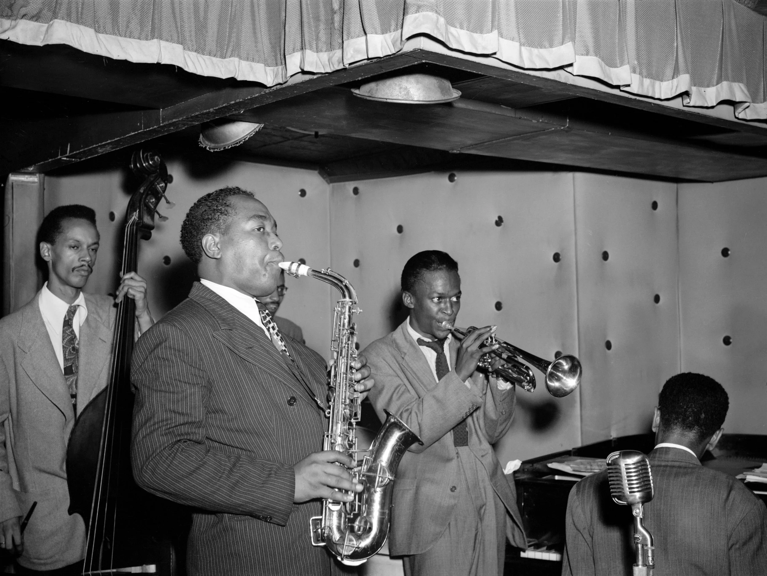 Charlie Parker playing alto saxophone with his band at the Three Deuces, New York, 1947
