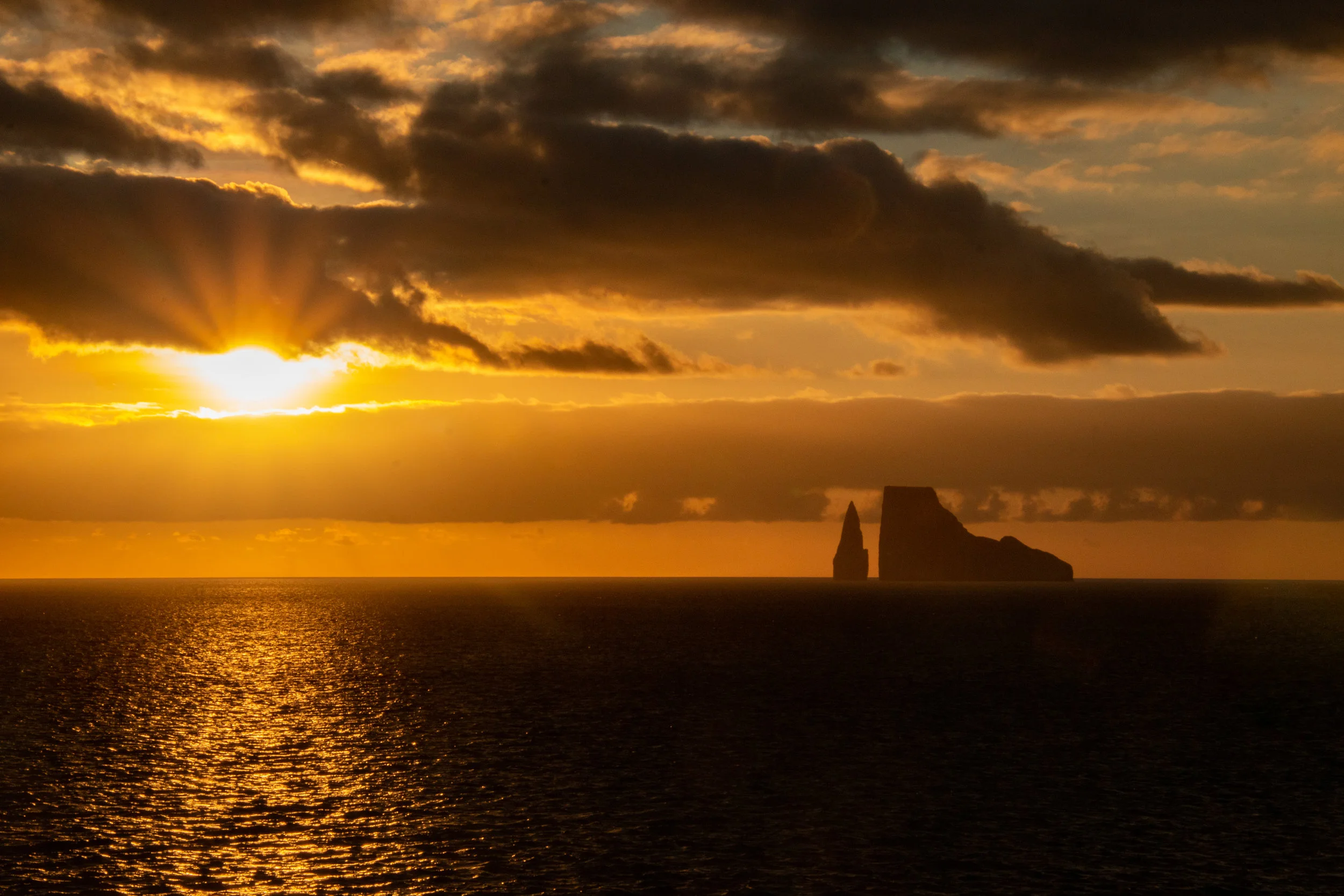 Sunset in Wreck Bay looking on at Leon Dormido, or Kicker Rock in English, San Cristobal.