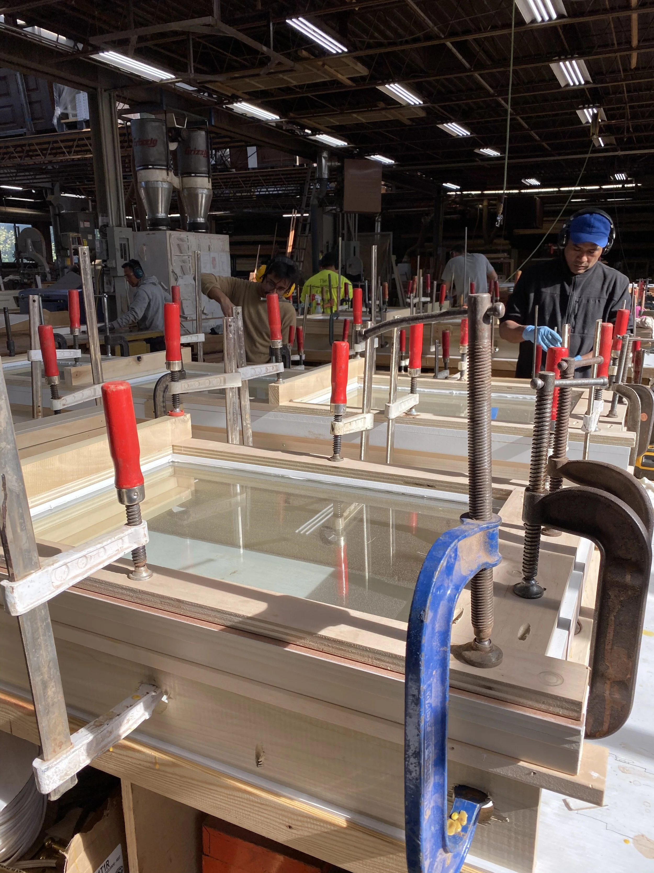 High performance polyurethane caulk is used at the joint between glass and wood.