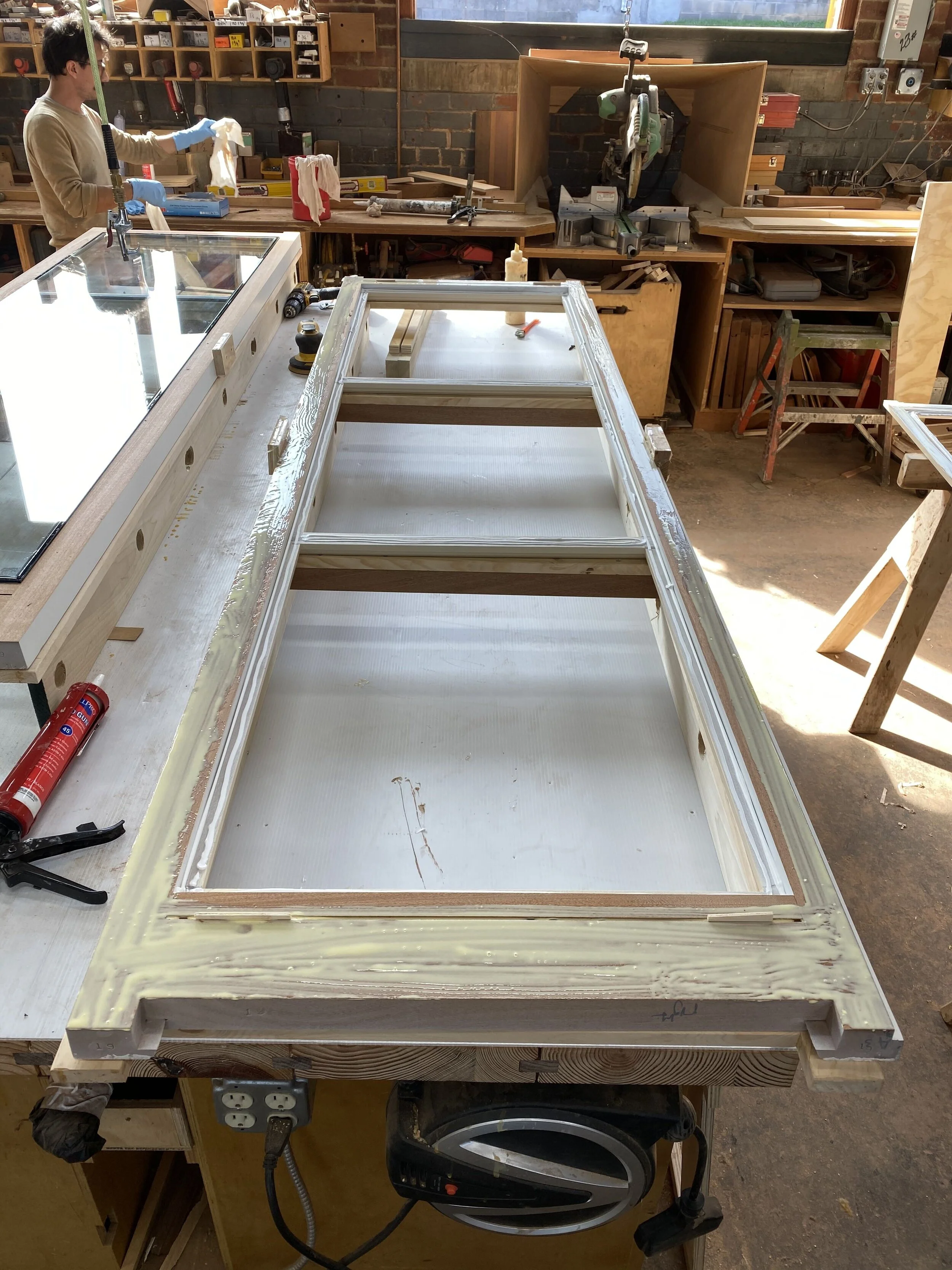 Fabricating the insulating glass panels in house allows us to coordinate the alignment of the three layered muntins perfectly.