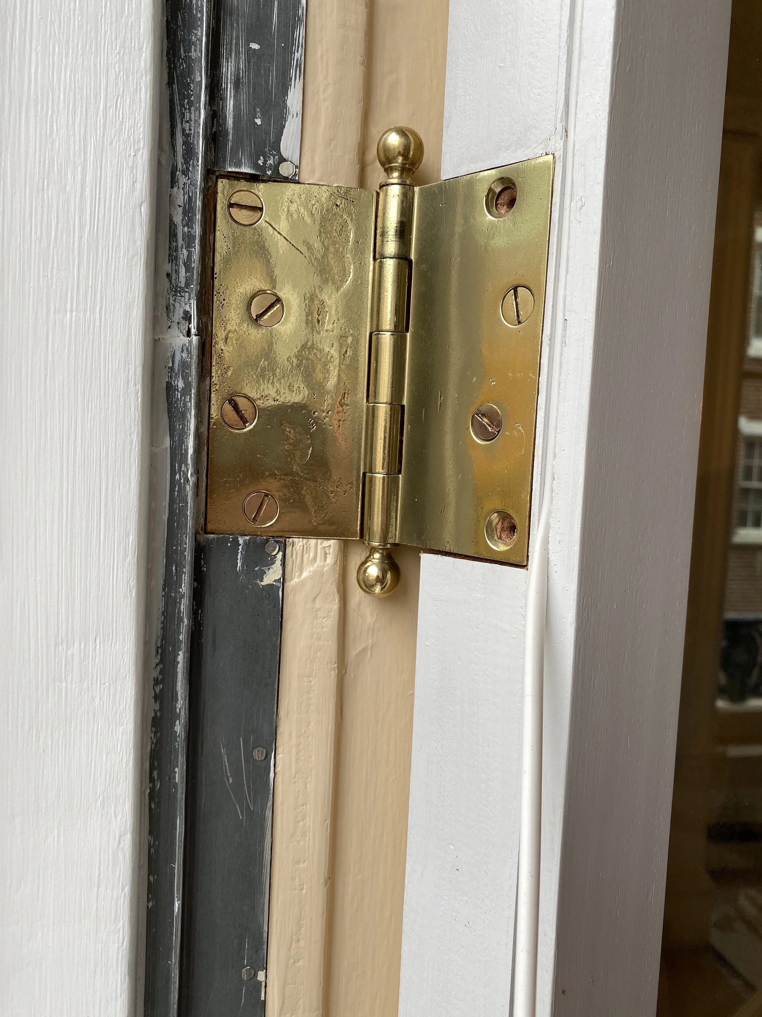 Note white rubber tube in groove adjacent hinge. This tube will be compressed against the 100 year old zinc weatherstripping at the frame. This discreet ingredient significantly improves the window’s attenuation of sound and thermal transference.