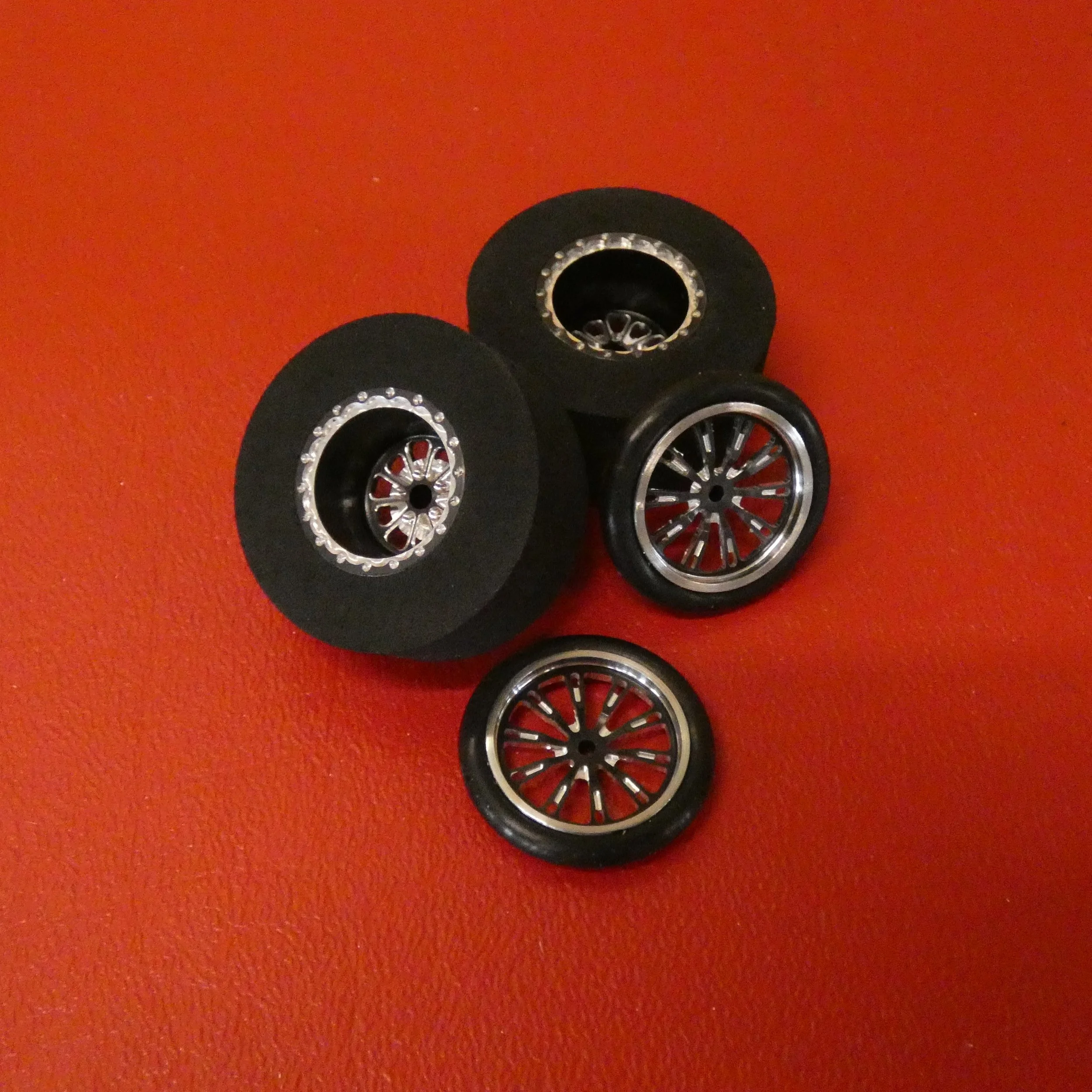 Hammer 17 fronts 15 x .500" rears black anodized a with 1 3/16" O.D. rubber  For slot cars