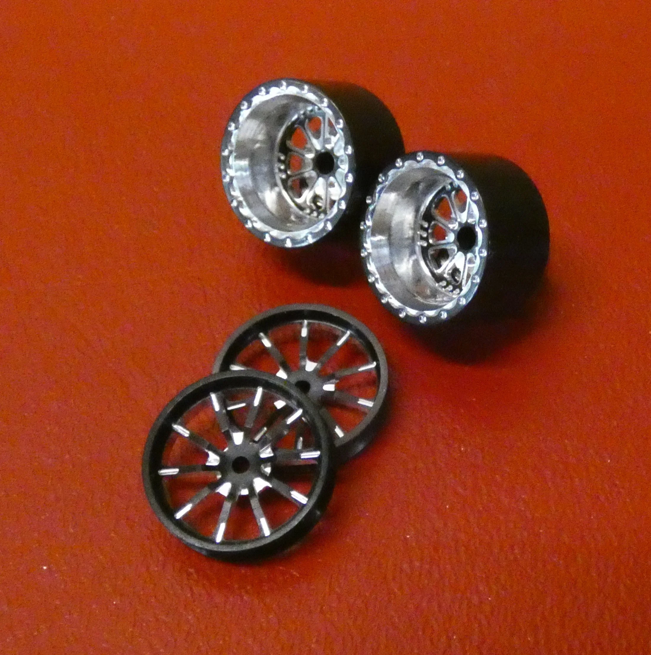 RC Comp Exiles 15 fronts 15x.400" rear.  black anodized for slot cars.