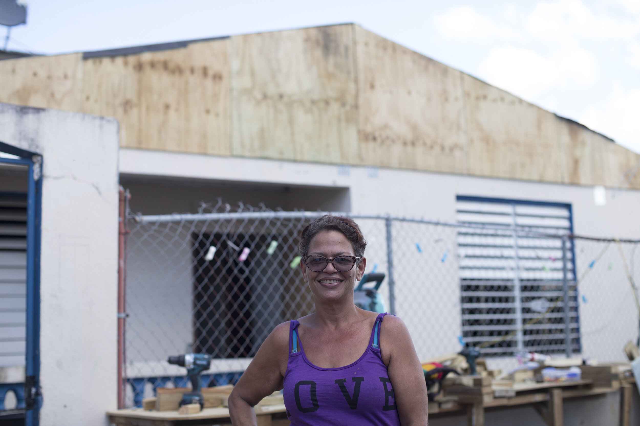  Carmen in front of her house, the first one to be completed. Photo by Gabriela Ros and Katja Torres. 