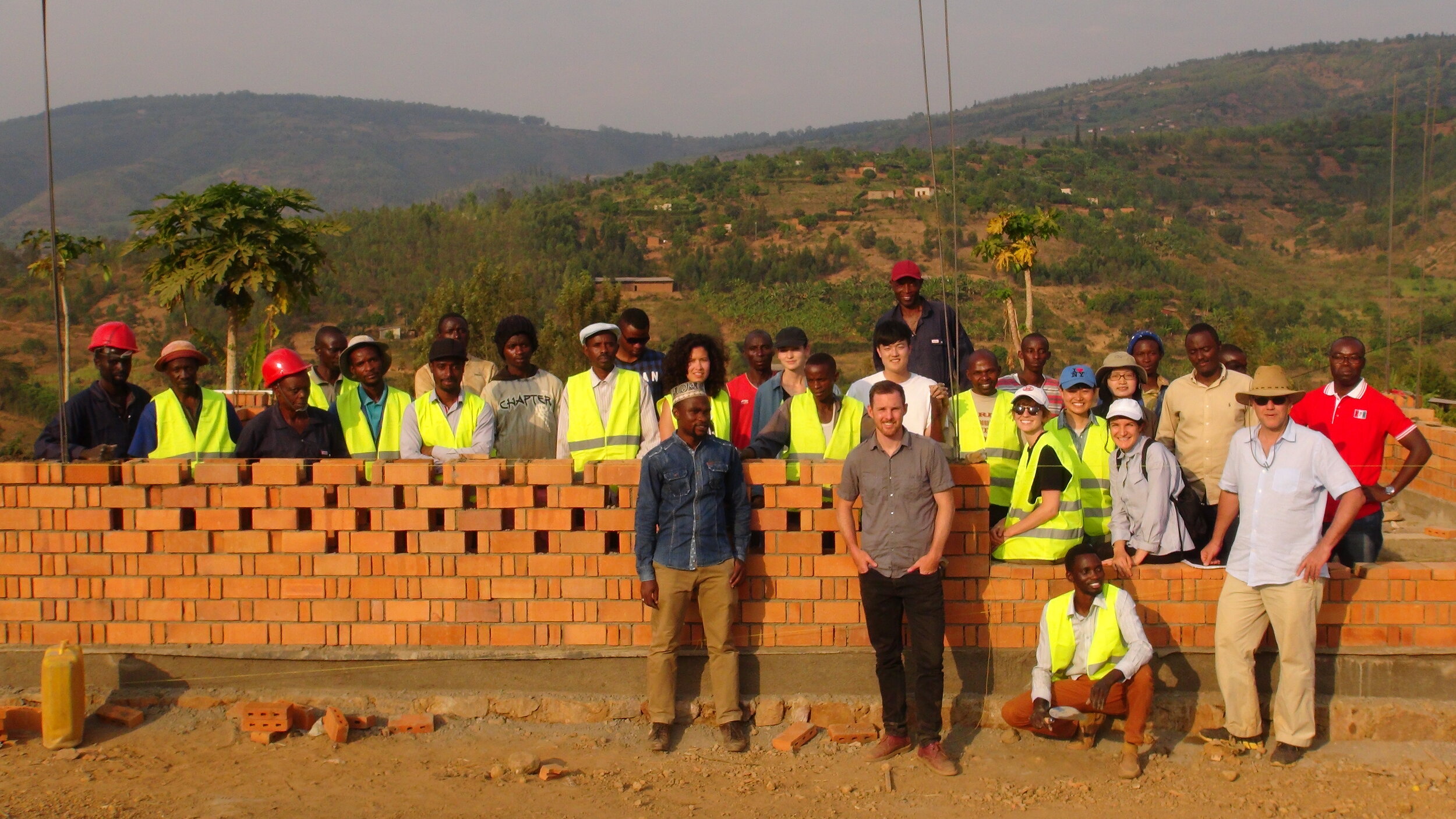  Design and construction crew including MIT students and faculty, SKAT masons and engineers, Rwanda Housing Authority masons and staff, and students from the University of Rwanda. Photo by Ben Segal. 