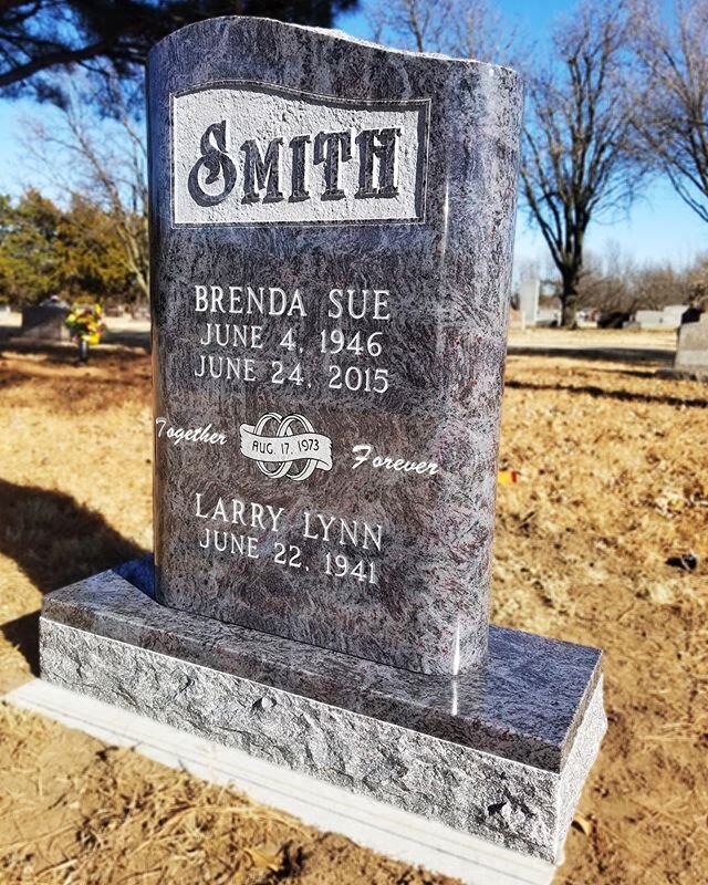 Look at how beautiful Bahama Blue Granite is!  This memorial was custom made to have rounded edges, with a rough rock pitched top.  The Family Name was left polished with the panel being recessed.  This turned out absolutely stunning.  The contrast o