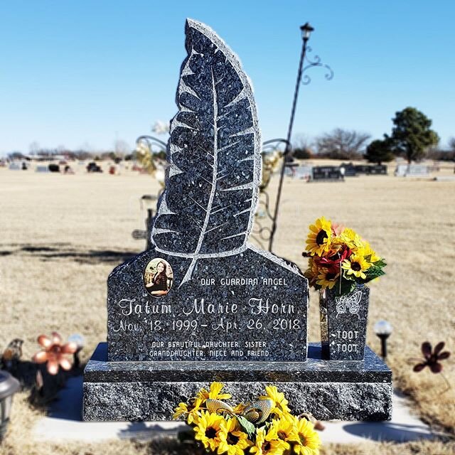 Here is a memorial that is very touching to us. This special cut of granite was designed &amp; shaped to resemble a feather. Made from Blue Pearl Granite, this monument is absolutely breath taking. The photo is a full color porcelain picture, which w