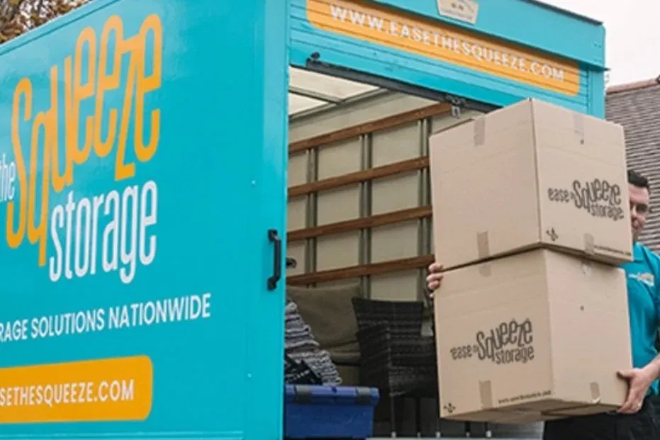 staff-loading-ease-the-squeeze-boxes-into-turquoise-van