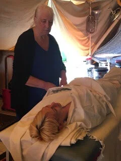 Serving as a body in a demonstration of body-wrapping, by Lyn Baylis, minister of Life Rites