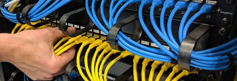 Older residential electrical service panel of the type BC insurers flag during underwriting and renewal reviews