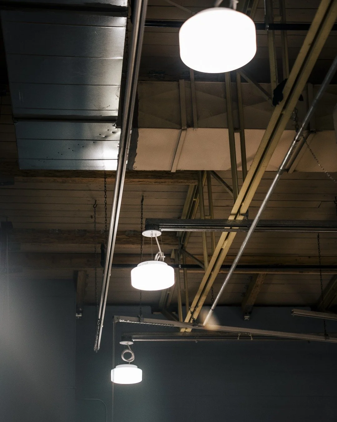 Lights on 💡⚡ The finished result of a commercial fit-out &mdash; every fixture hung, aligned, and wired clean against the exposed structure. This is the part that makes the rough-in worth it. ✨

#CommercialElectrical #ElectricalContractor #Vancouver