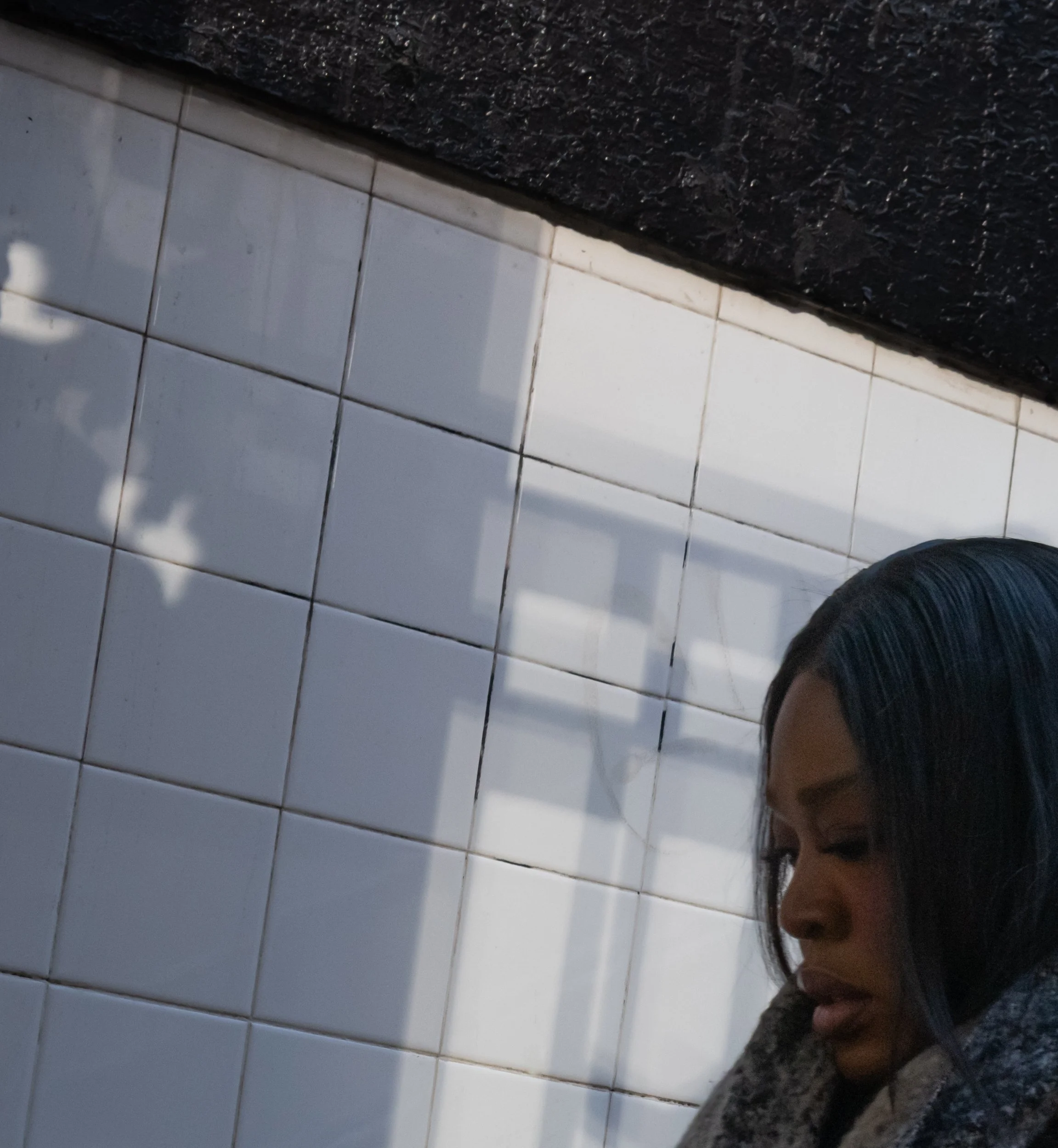Woman at Subway Entrance, 2026