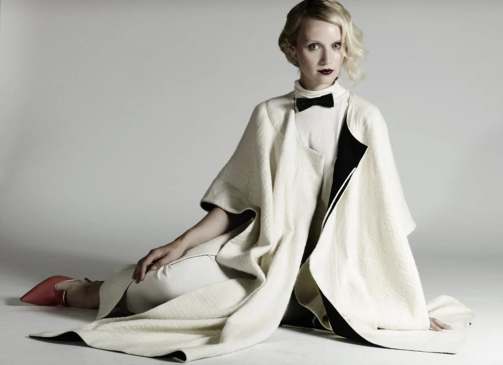Emily wears dress by Basharatyan V , cape by Issa , shoes by Malone Souliers and bow tie by Absolute Vintage