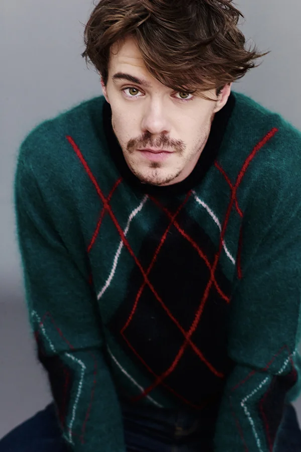 Sam is wearing jumper by A Child of the Jago