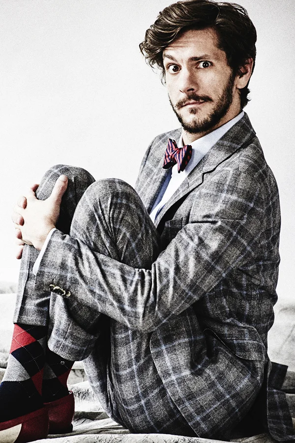 Mathew wears suit by Tommy Hilfiger, shirt and bow tie by Brooks Brothers, socks by Burlington and shoes by Caterina Belluardo