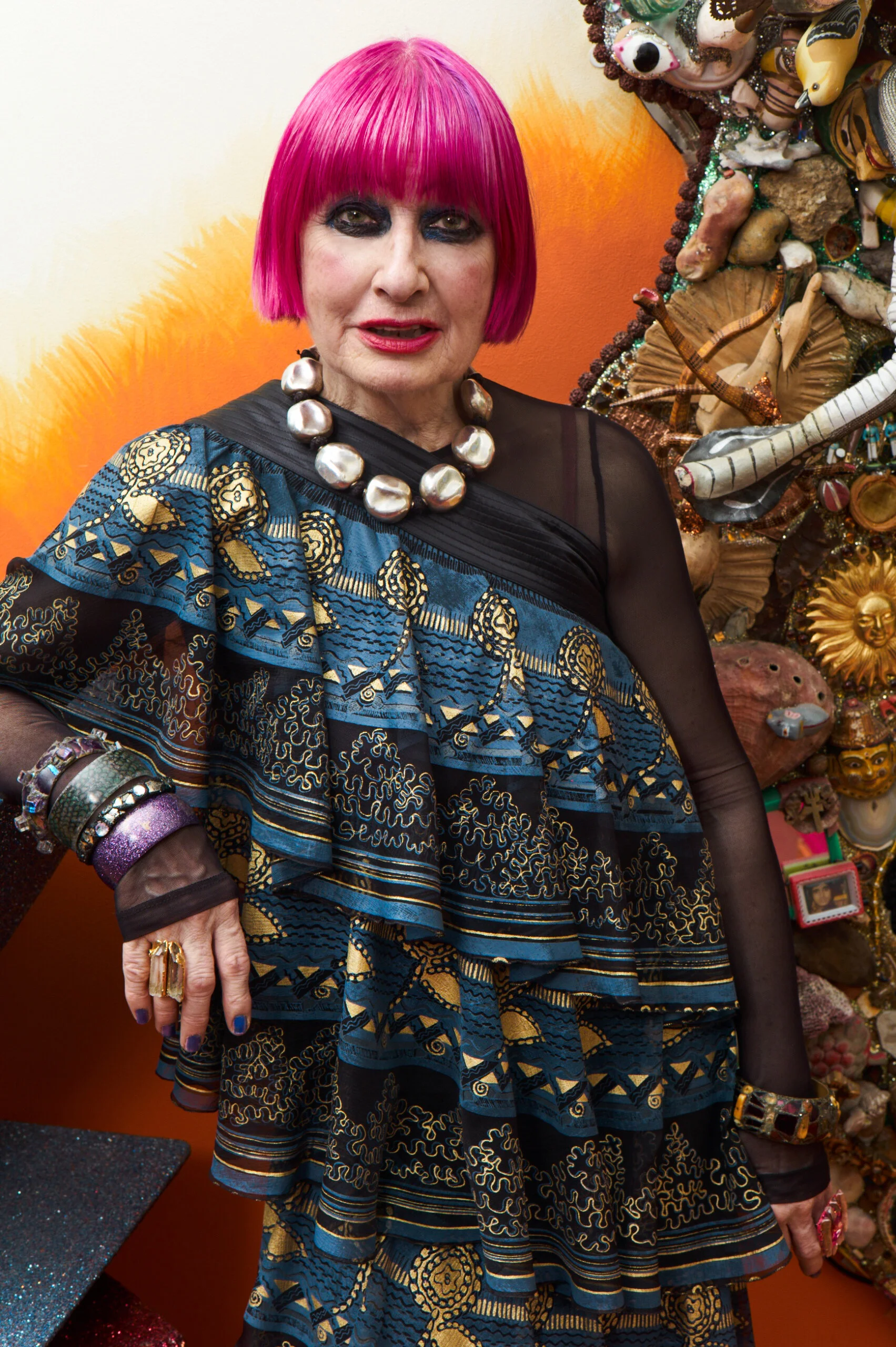 Zandra Rhodes wearing a piece of her A/W16 “Songket Brocade” collection with the “Knitted Circle” design style 16/157, photographed in her home by Ram Shergill