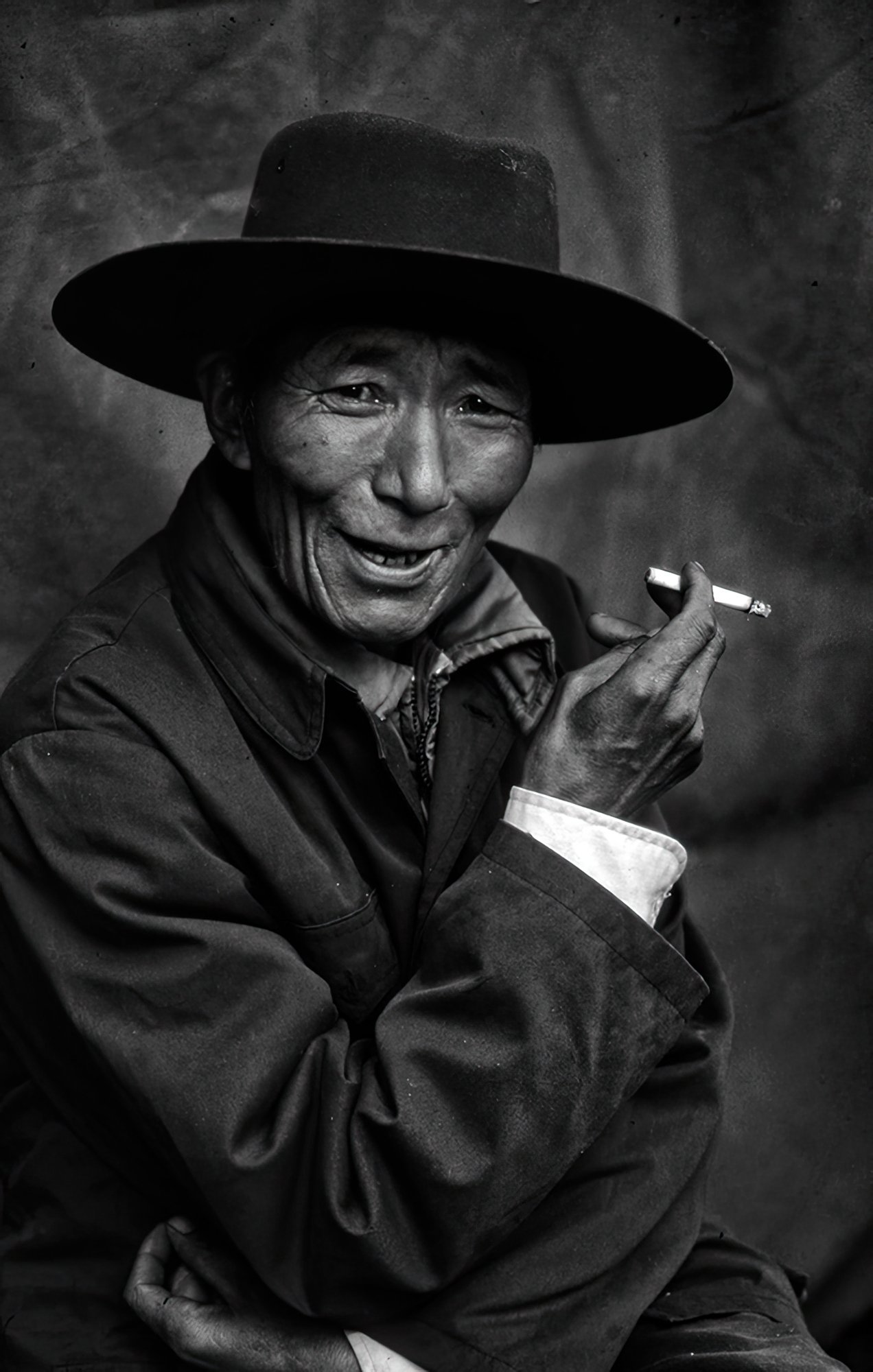 Tibet portrait of a Tibetan man smoking.jpg