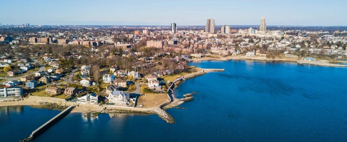 Aerial view of Montreal showcasing its vibrant cityscape, including buildings, parks, and the St. Lawrence River. Contracting Reform Westchester County, NY city