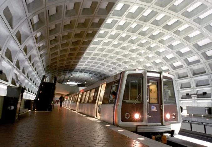 Washington Metropolitan Area Transit Authority WMATA Washington, DC A train approaches the station, ready to stop and allow passengers to board and disembark.