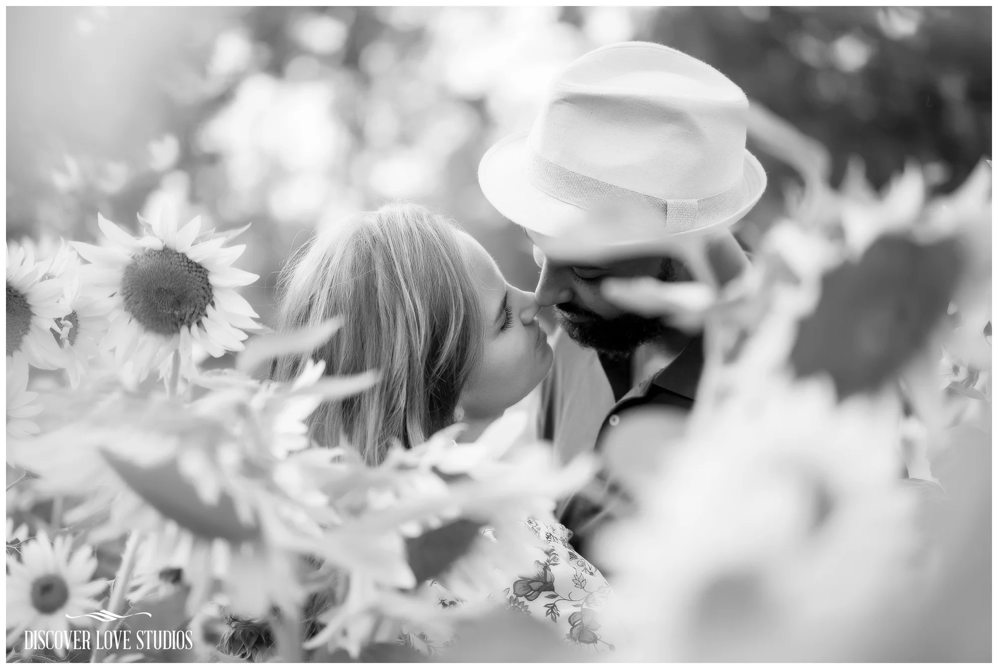DanaAshfordEngagementSessionSunflowerFieldBushNVineFarmYorkSCDiscoverLoveStudios_0011.jpg