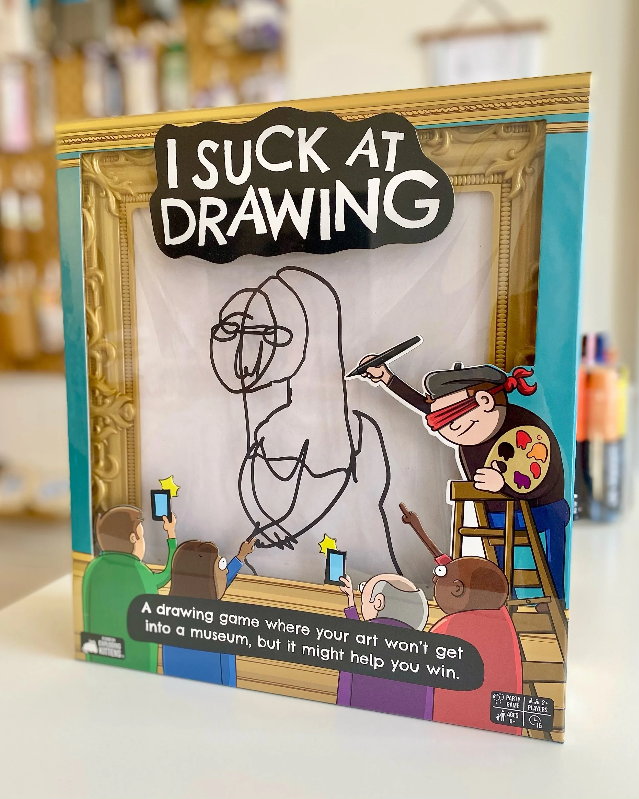 &ldquo;I SUCK AT DRAWING.&rdquo; Something we hear daily at our art store. First of all&hellip; you don&rsquo;t. But also, we have a game for you.

In this game by Exploding Kittens, read a secret word, draw it WITHOUT LOOKING, and see if everyone el