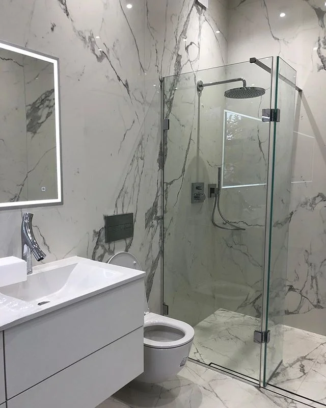 Porcelain tile bathroom using 1.2 x 2.78 meter tiles. Installation by @johnbocchetta_tiling Get in touch for tiles we supply and source for developments.
.
.
.
.
.
#tile #tiles #tiledesign #design #living #bathroomdesign #bathroom #bathroomdecor #dec
