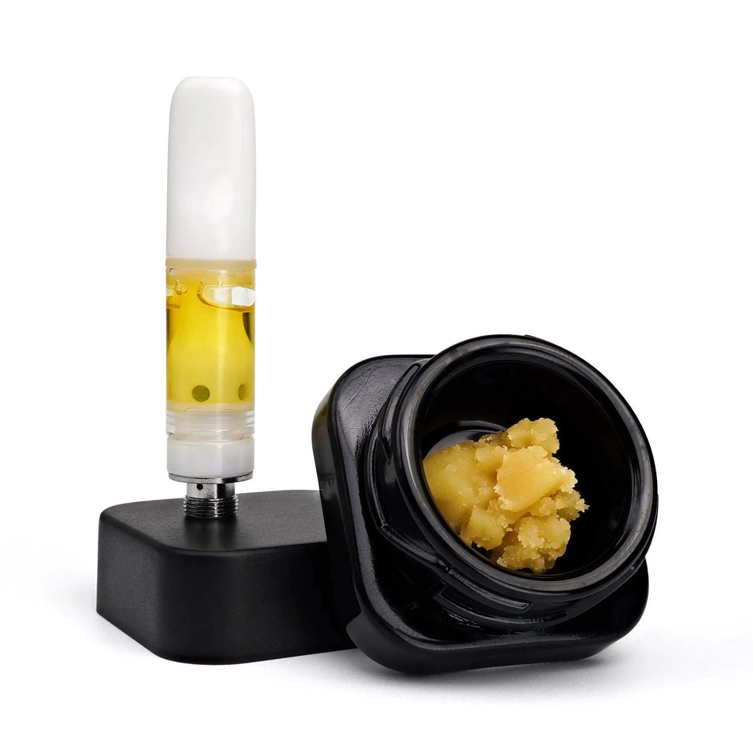 Live Hash Rosin in open black glass packaging with Live Hash Rosin Cartridge sitting upright on black jar lid.