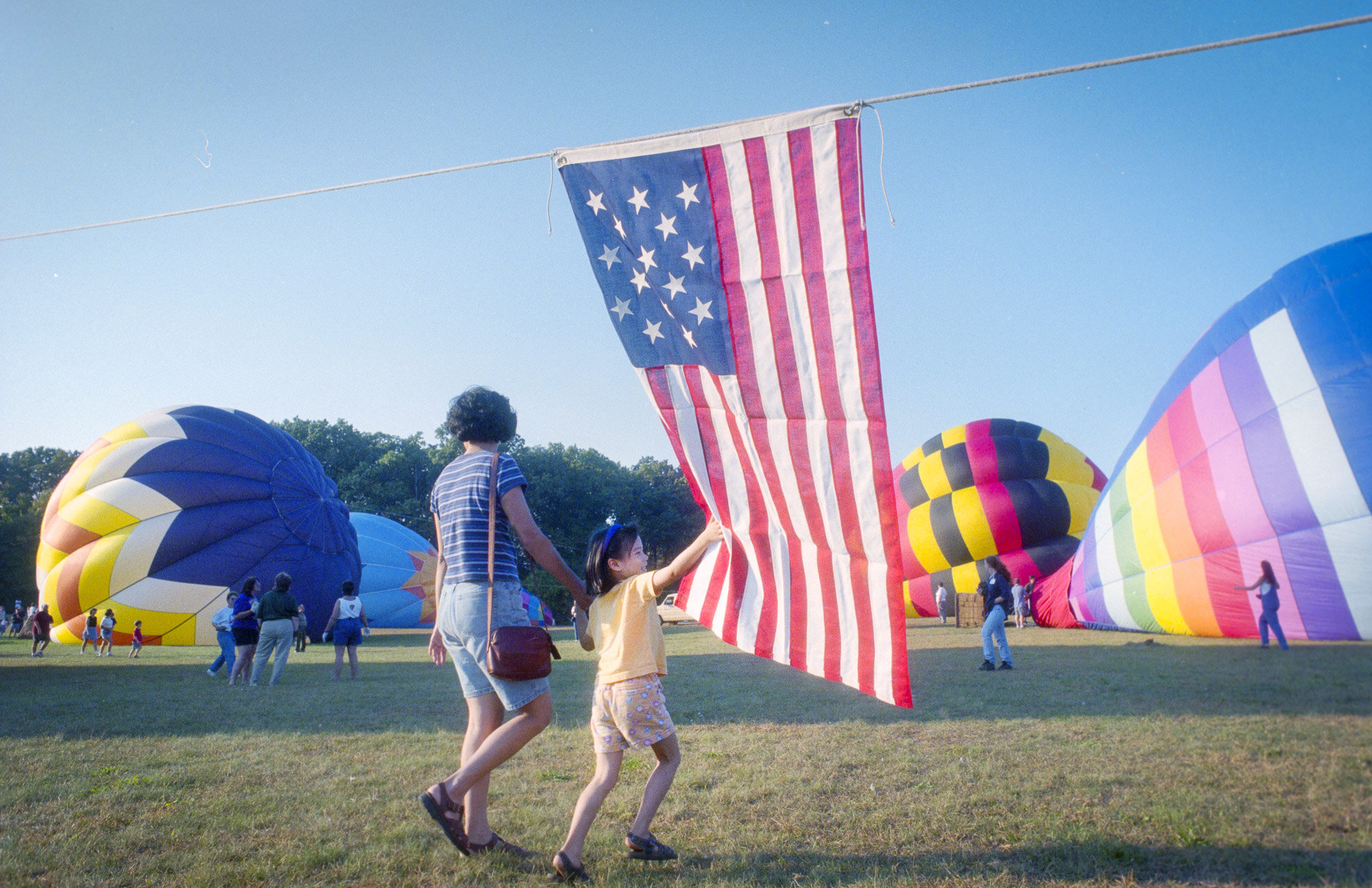 A Child and Mother at Balloon Festival