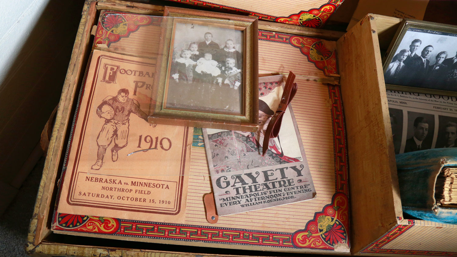 Old family photo, sports and theatre memorabilia are on display.
