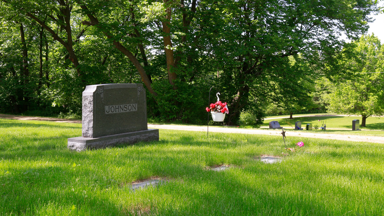 A family grave site with basket of flowers in Mound Grove Cemetery