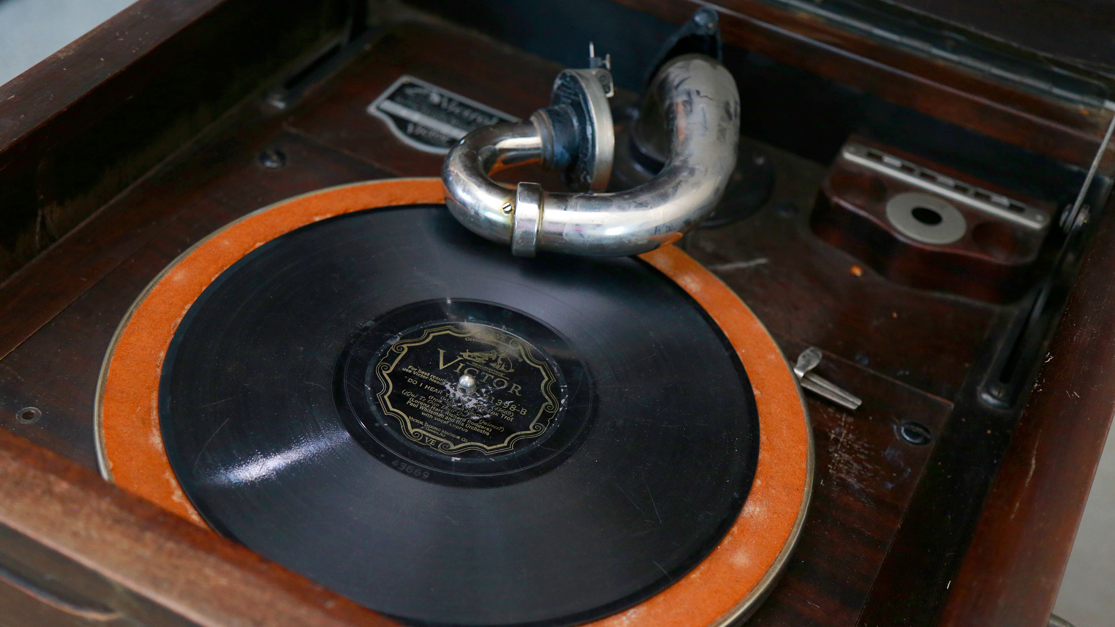 Very early phonograph with a record ready to play.