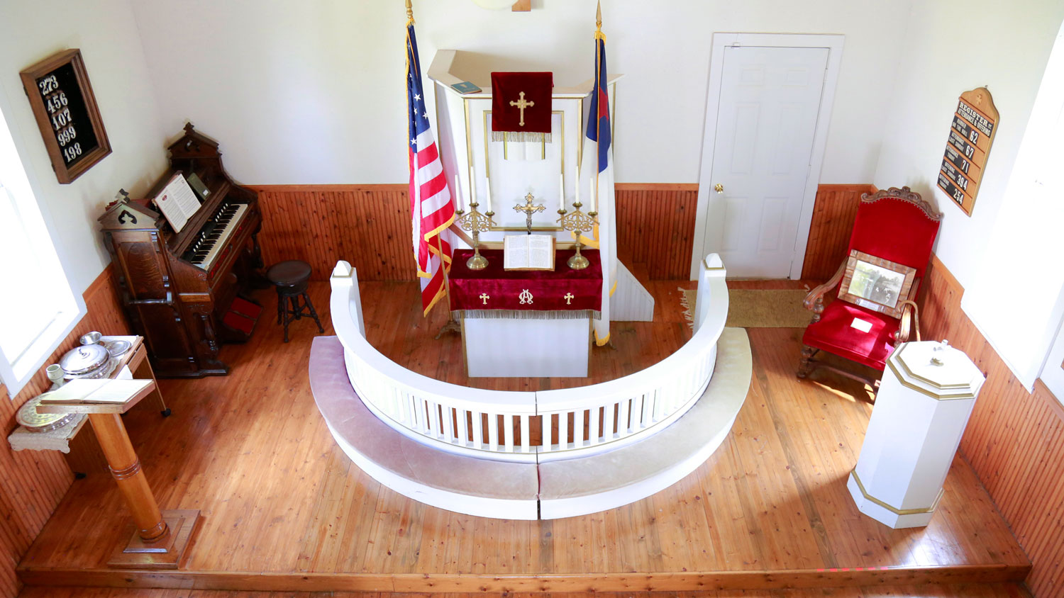 Interior view of altar and communion rail in Pioneer Church