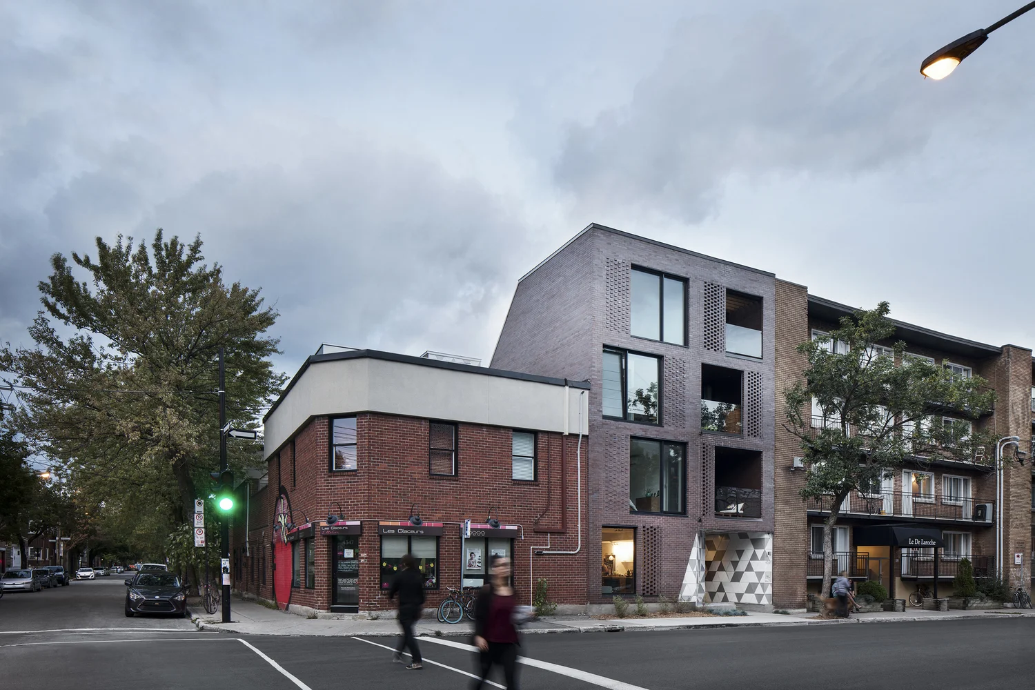 A new building next to an existing commercial space in Montreal, via ArchDaily