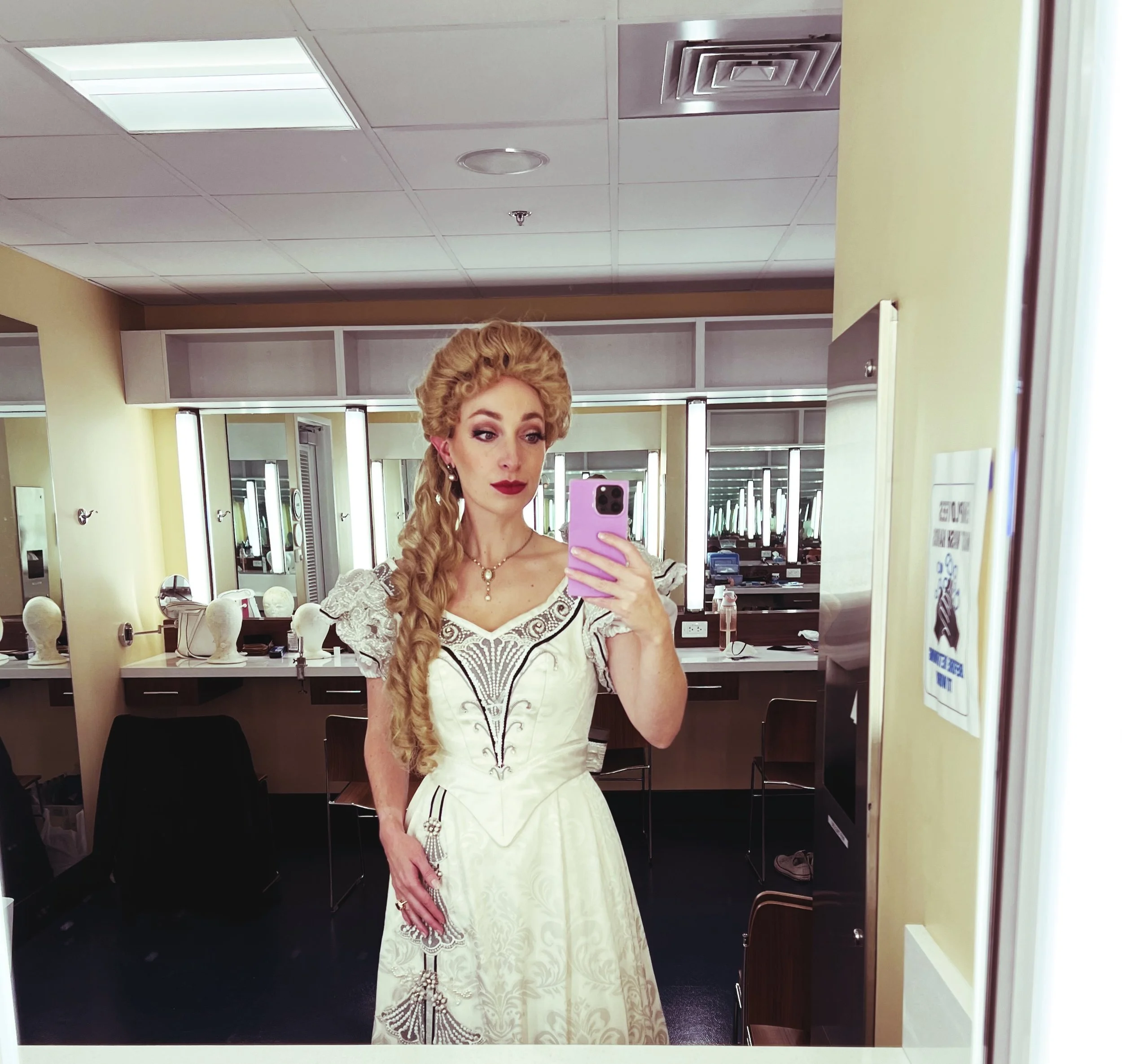  Leslie wearing white wedding dress and blond wig, backstage of  A Gentleman’s Guide to Love and Murder . 