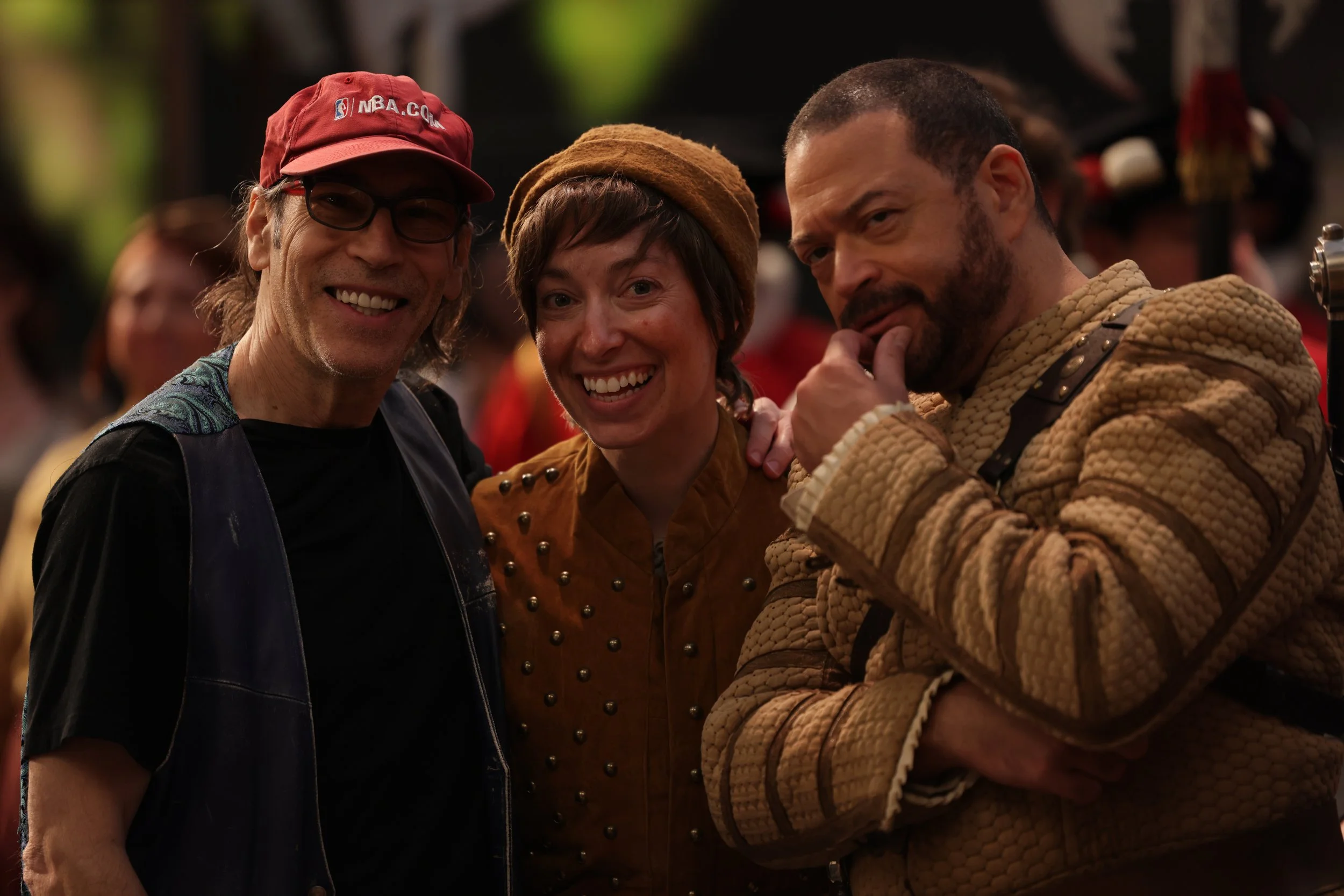 Leslie as Boy, wearing brown shirt and hat, and short wig, pictured backstage of Plump Jack, with director and cast mate. Photo by Kathrine Kohl.
